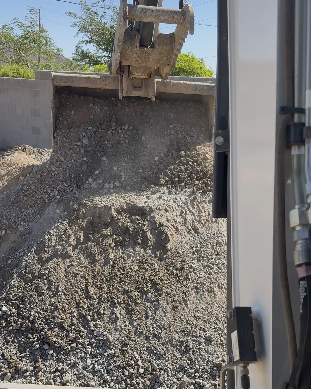 Processed recycled concrete being prepared for reuse onsite
